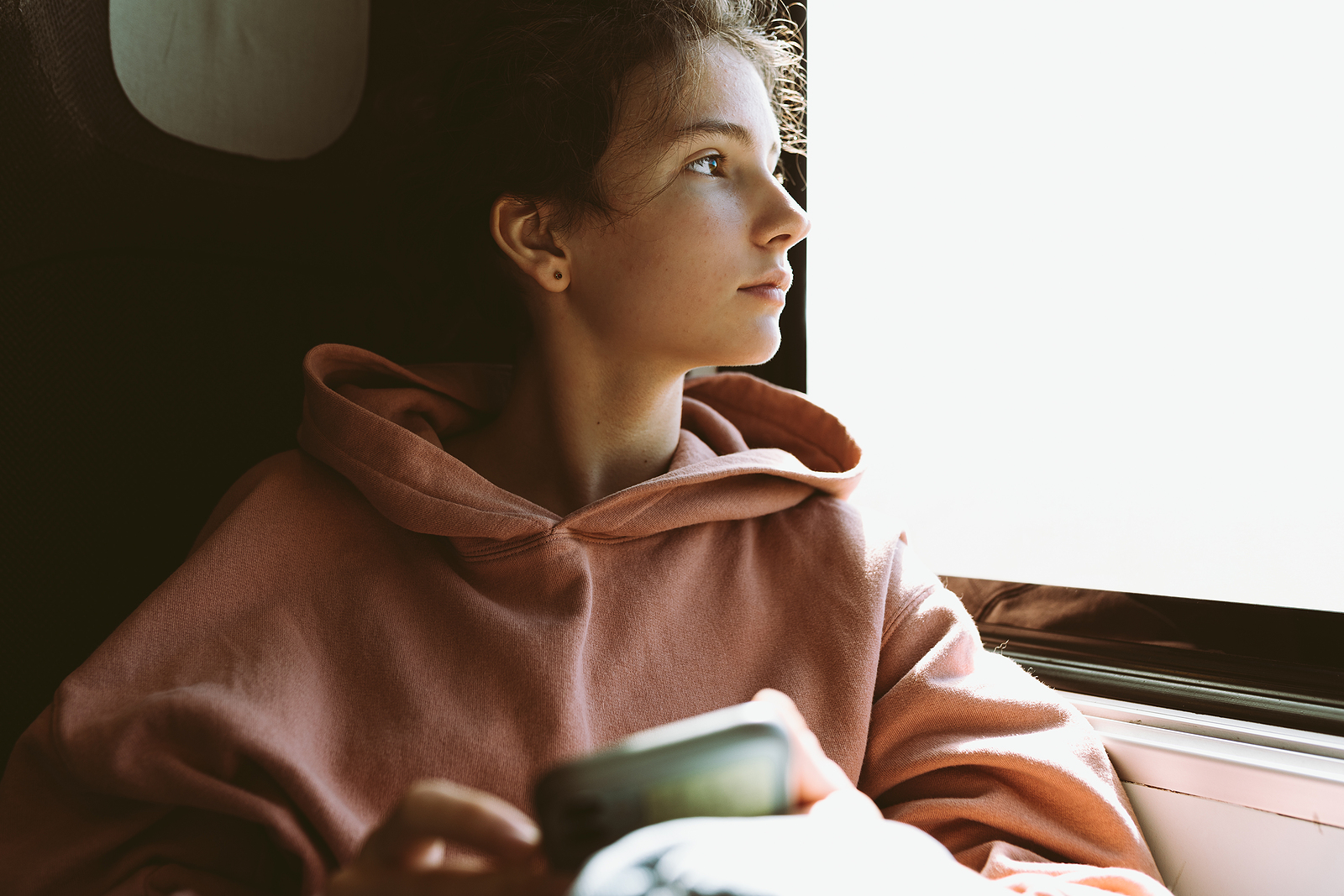 Teenage Girl In Warm Pink Sweatshirt Sits Near Window In Train C About pdl
