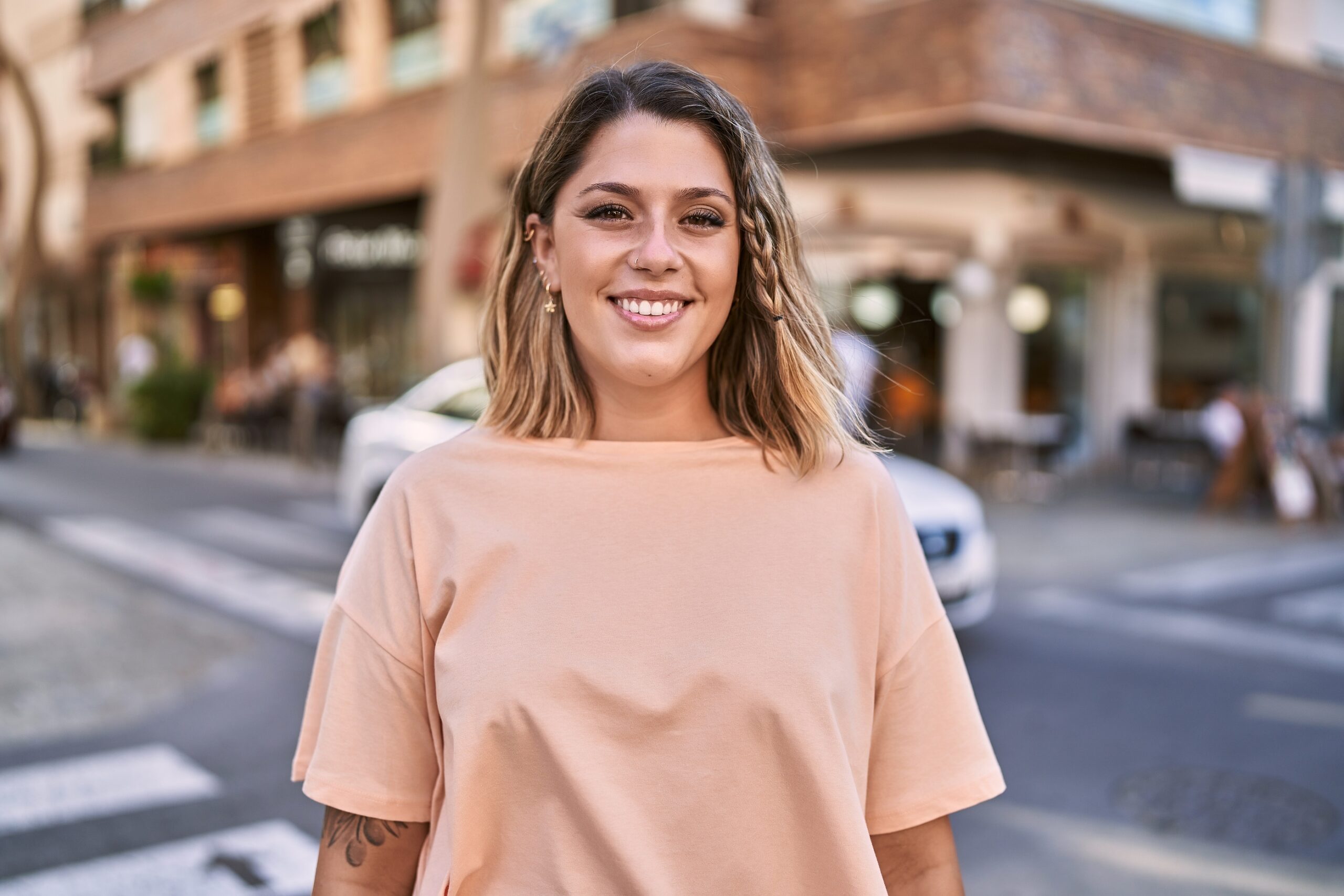 Young hispanic woman smiling confident at street About pdl